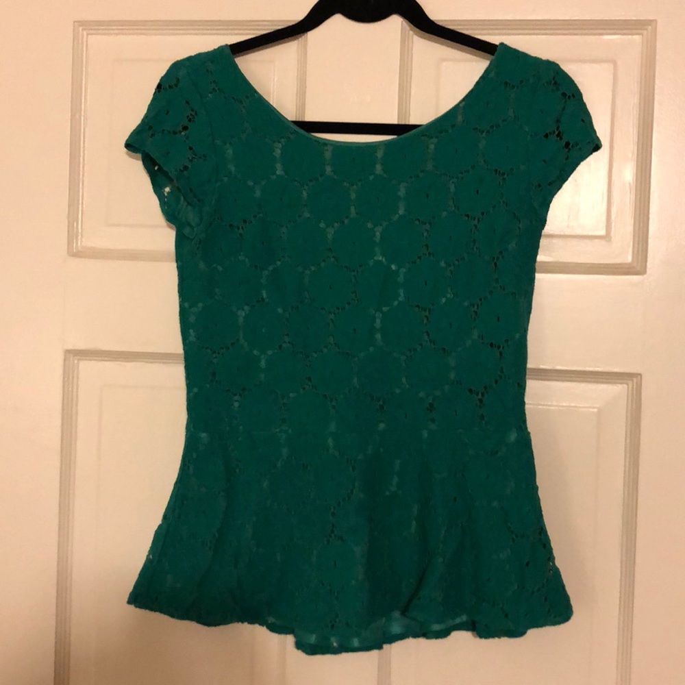 Emerald green peplum top with doily print